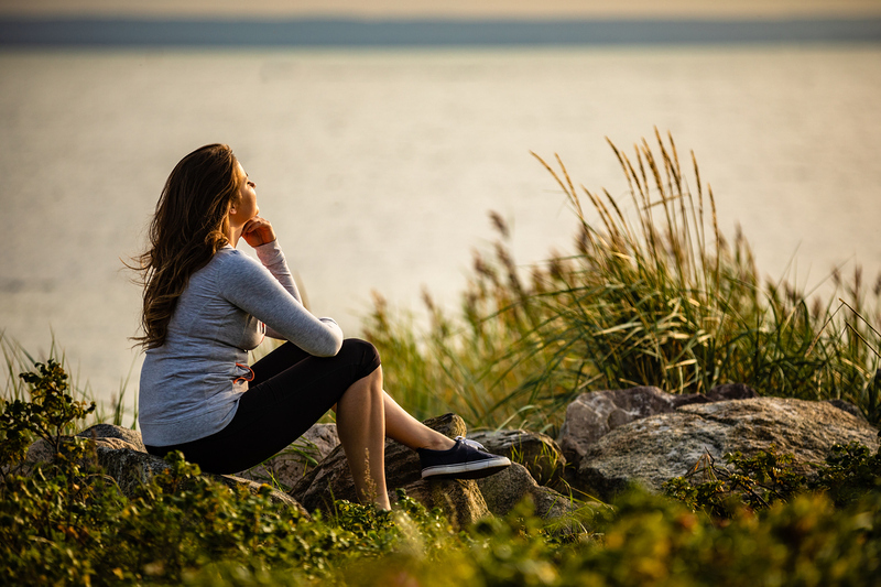 Woman sitting at seaside