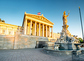 Austrian parliament building with Athena statue on the front in Vienna on the sunrise