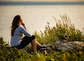 Woman sitting at seaside