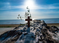 The wooden cross on the beach