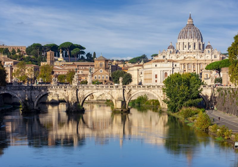 St Peter's basilica in Vatican and Victor Emmanuel II bridge in Rome, Italy (translation 'In honor of prince of Apostles; Paul V Borghese, Pope, in year 1612 and 7th year of his pontificate)