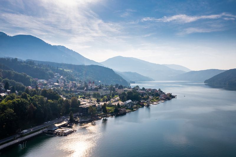 Millstatt city at Lake Millstatt in Carinthia. Scenic aerial panorama of the touristic region in South of Austria.